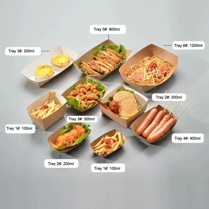 A variety of disposable paper food trays in multiple sizes filled with fried foods, pastries, sausages, and noodles, showing the difference between grease-proof and regular paper tray performance.