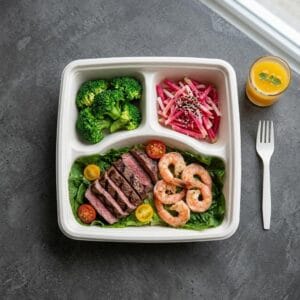 1000ml 3 compartment bagasse bento box packed with takeaway meal