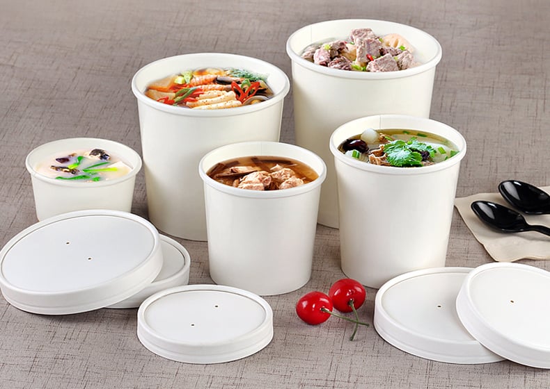 white paper cups and lids