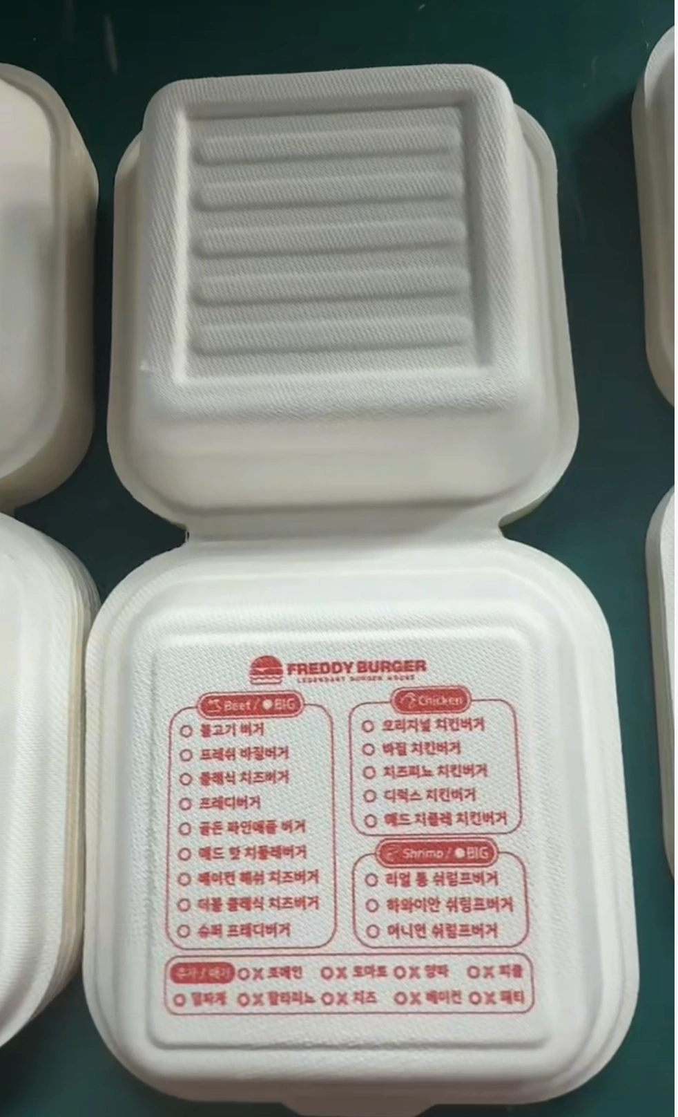Custom Printing on a Bagasse Burger Box Red custom menu printing on the inner base of a sugarcane bagasse burger box
